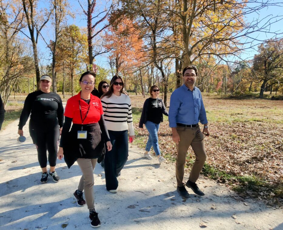 Diverse employees going for a walk on a trail