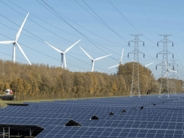 Landscape featuring wind, solar, and transmission lines