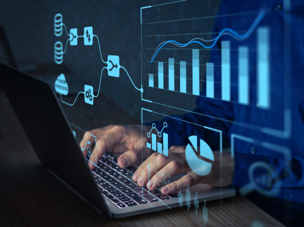 Analyst working with Business Analytics and Data Management System on computer to make report with KPI and metrics connected to database. Corporate strategy for finance, operations, sales, marketing