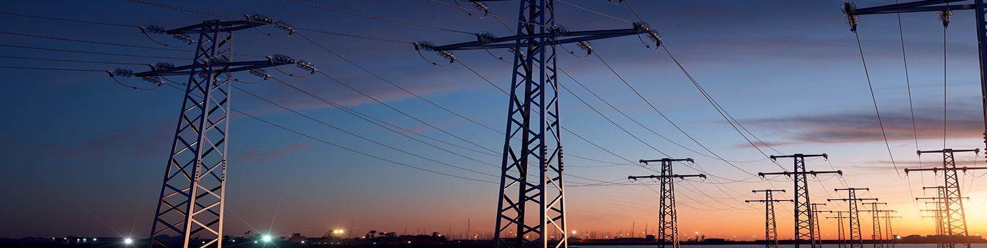 Transmission lines in front of sunset