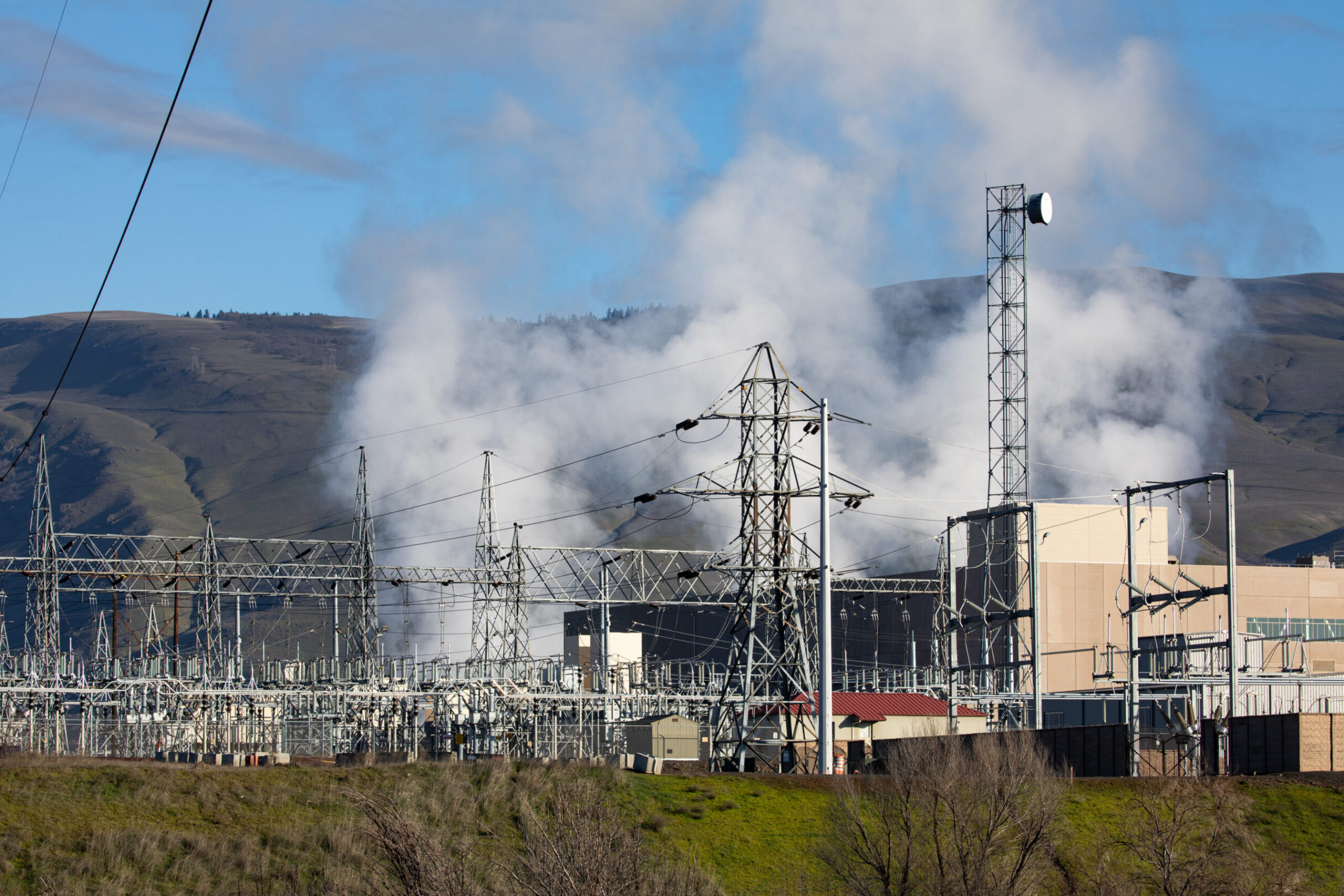 High voltage electrical power substation and transmission infrastructure beside a major data center campus
