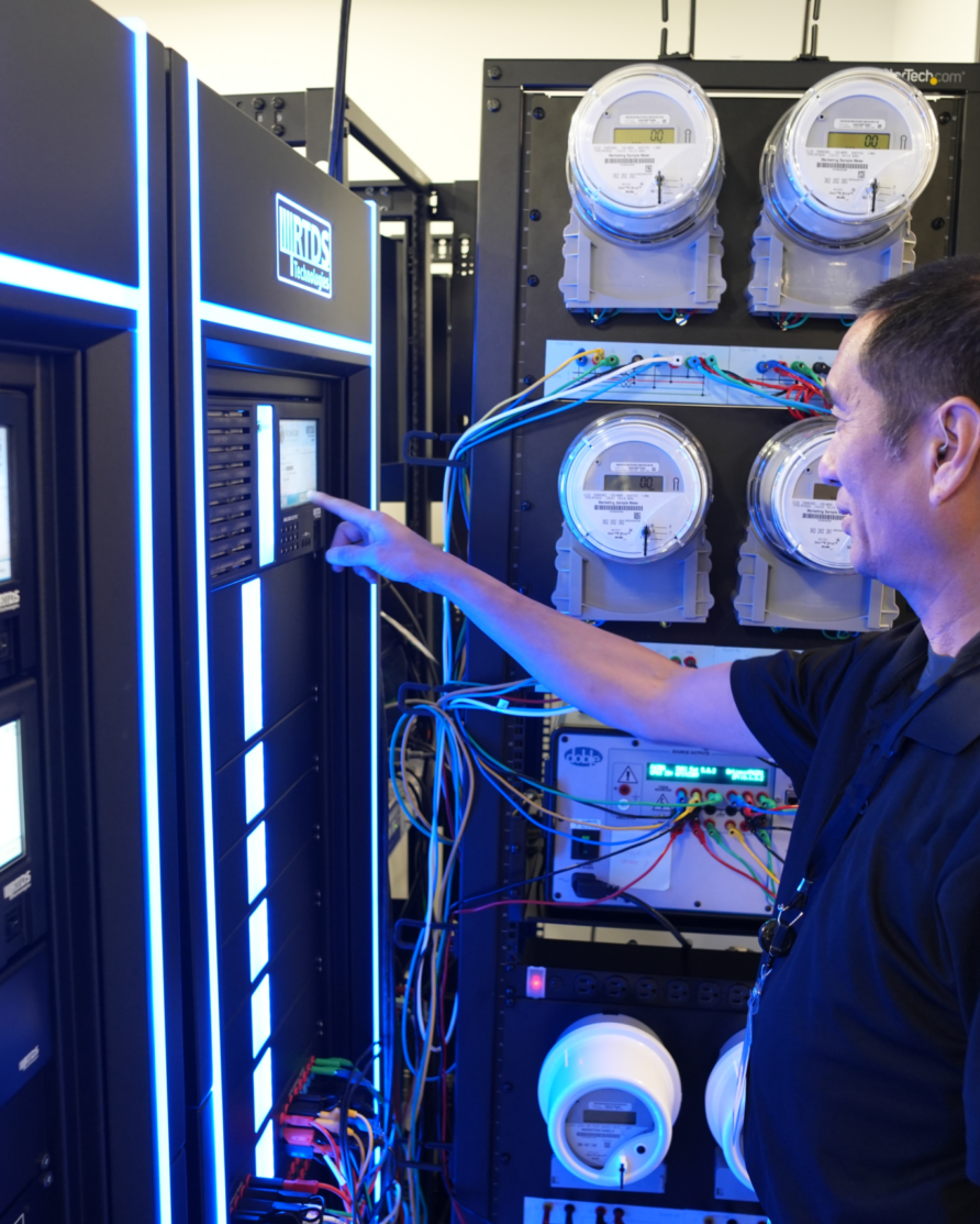 Protection engineer from Danovo Energy Solutions tinkering with the RTDS lab equipment.