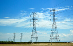Transmission towers with blue sky.